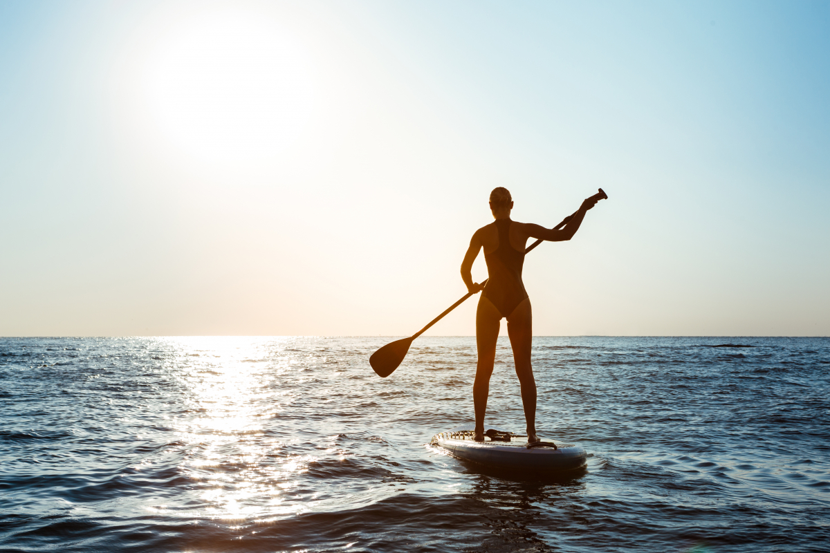 silhouette-of-young-beautiful-woman-surfing-in-sea-at-sunrise.jpg