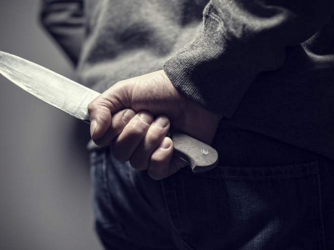 На Севере Красноярского края грабитель ножом ударил продавца. Фото: Depositphotos/BrianAJackson